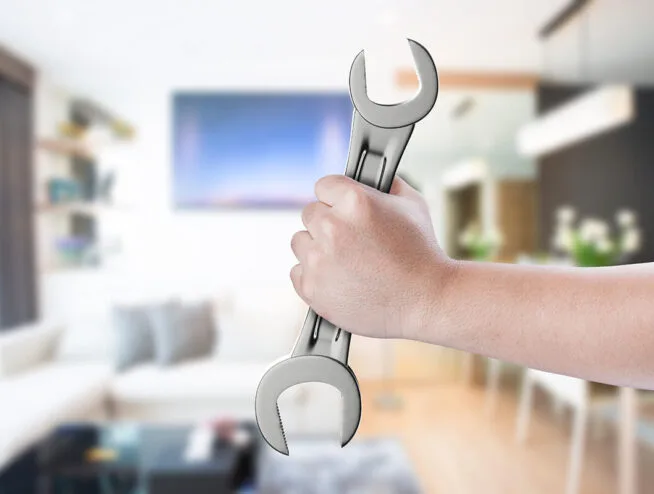 London builders and electricians performing property maintenance with professional tools.