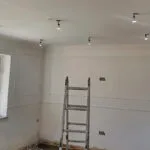 London builders and electricians extending a roof, installing battens and weatherproof membrane for an extension project.